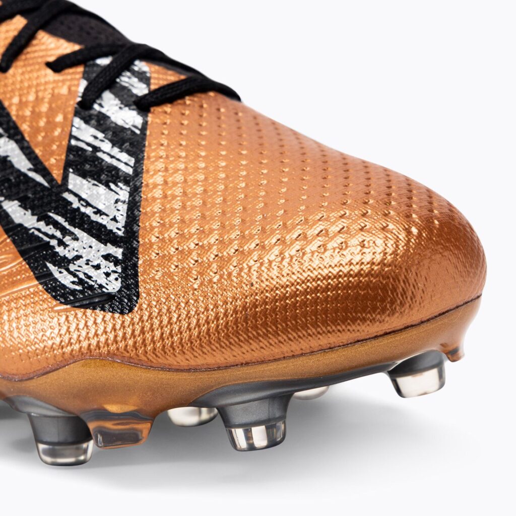 Футбольные бутсы New Balance Tekela Pro Low Laced V4+ FG copper