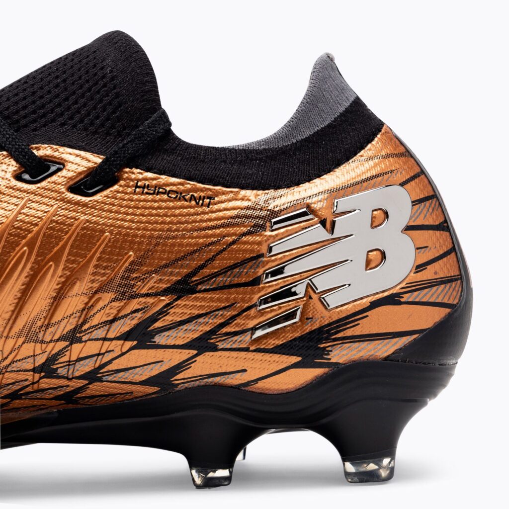 Футбольные бутсы New Balance Tekela Pro Low Laced V4+ FG copper