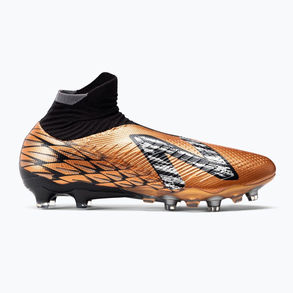 Футбольные бутсы New Balance Tekela Pro V4+ FG copper