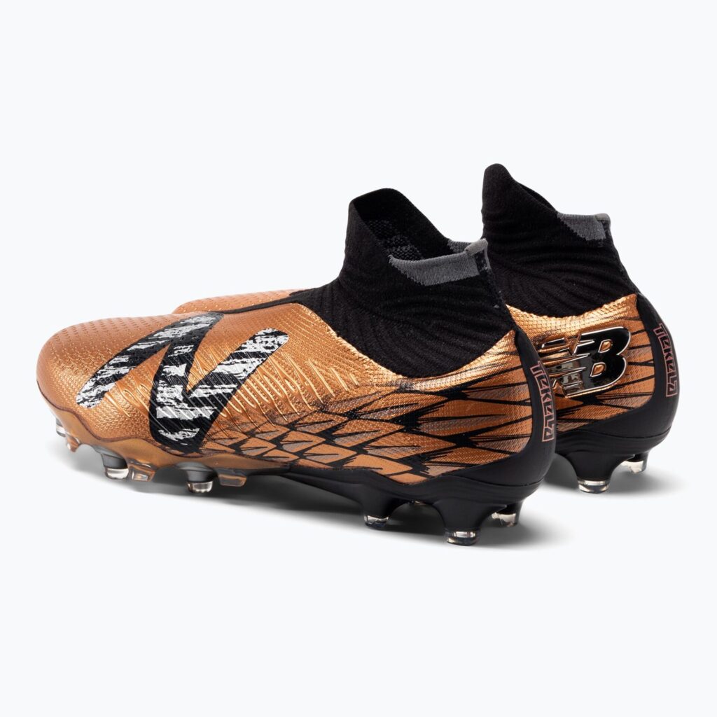 Футбольные бутсы New Balance Tekela Pro V4+ FG copper
