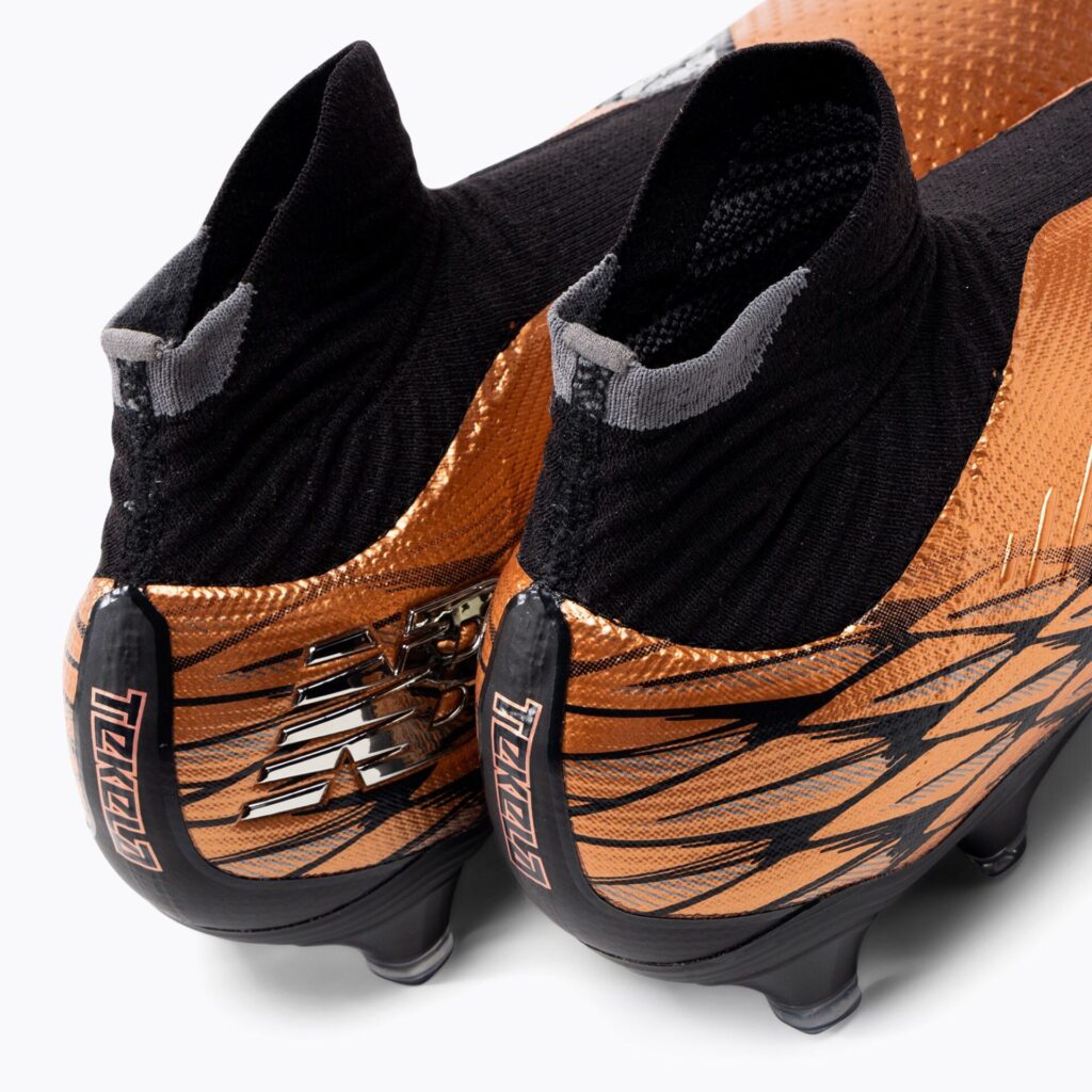Футбольные бутсы New Balance Tekela Pro V4+ FG copper