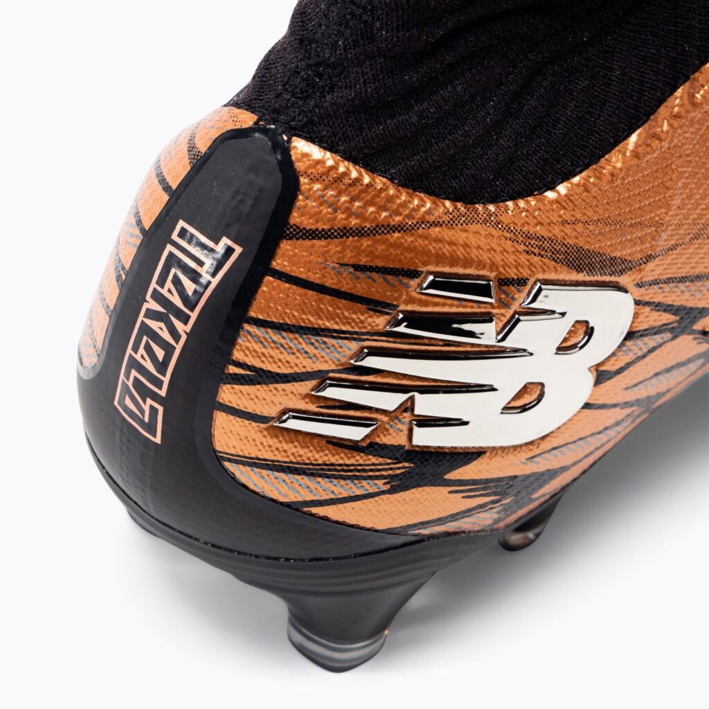 Футбольные бутсы New Balance Tekela Pro V4+ FG copper